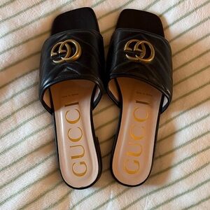 Gucci Black and Gold Mules